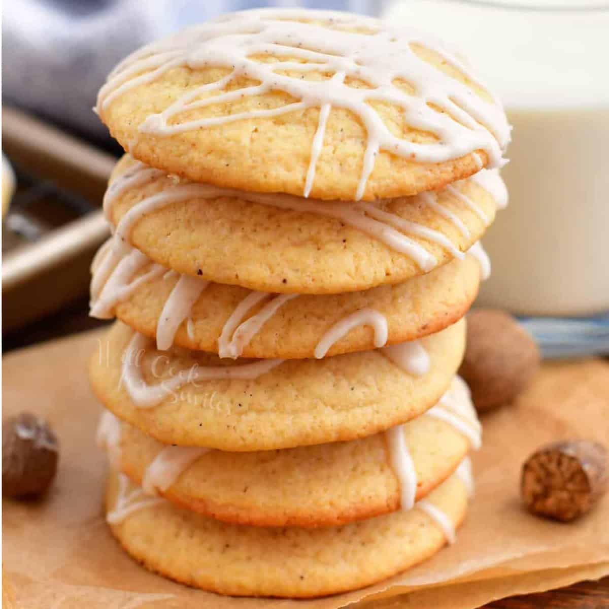 A stack of cookies drizzled with a white glaze.