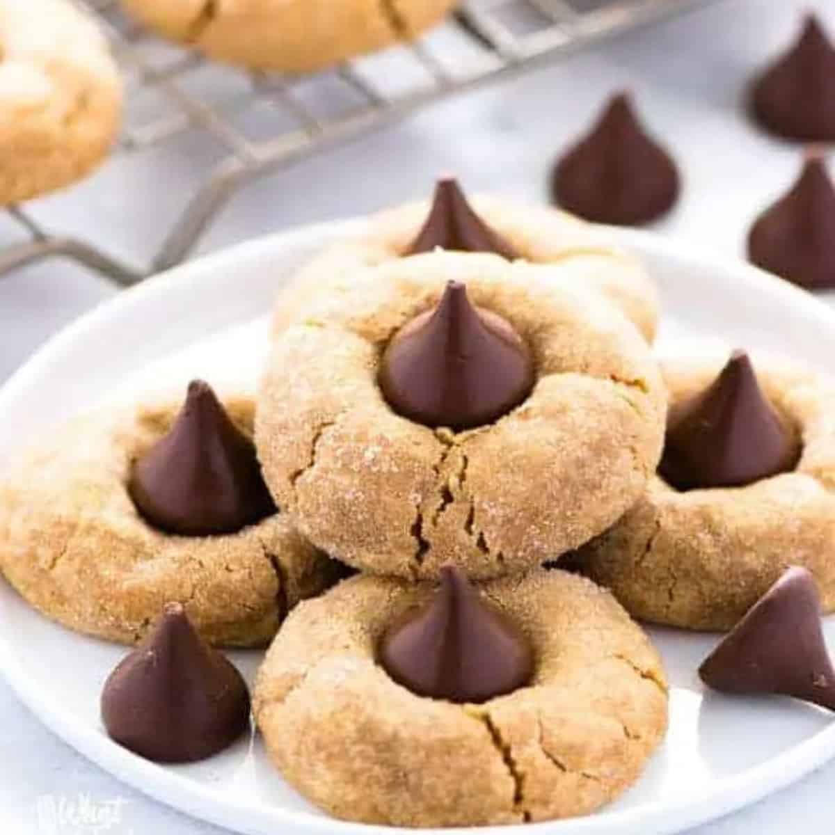 A plate of peanut butter blossom cookies.