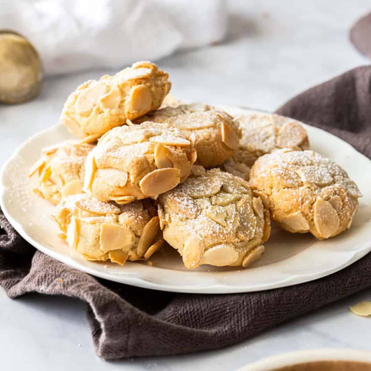 A plate of small almond cookies.