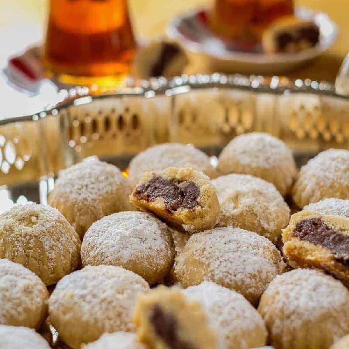 A tray of round pastries with a brown filling.