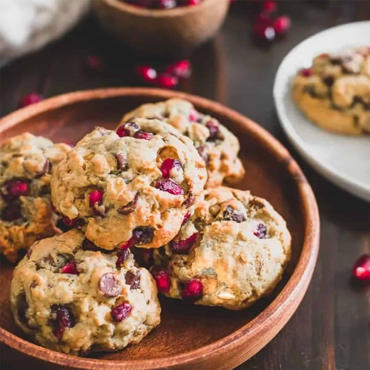 A bunch of cookies in a wooden bowl.