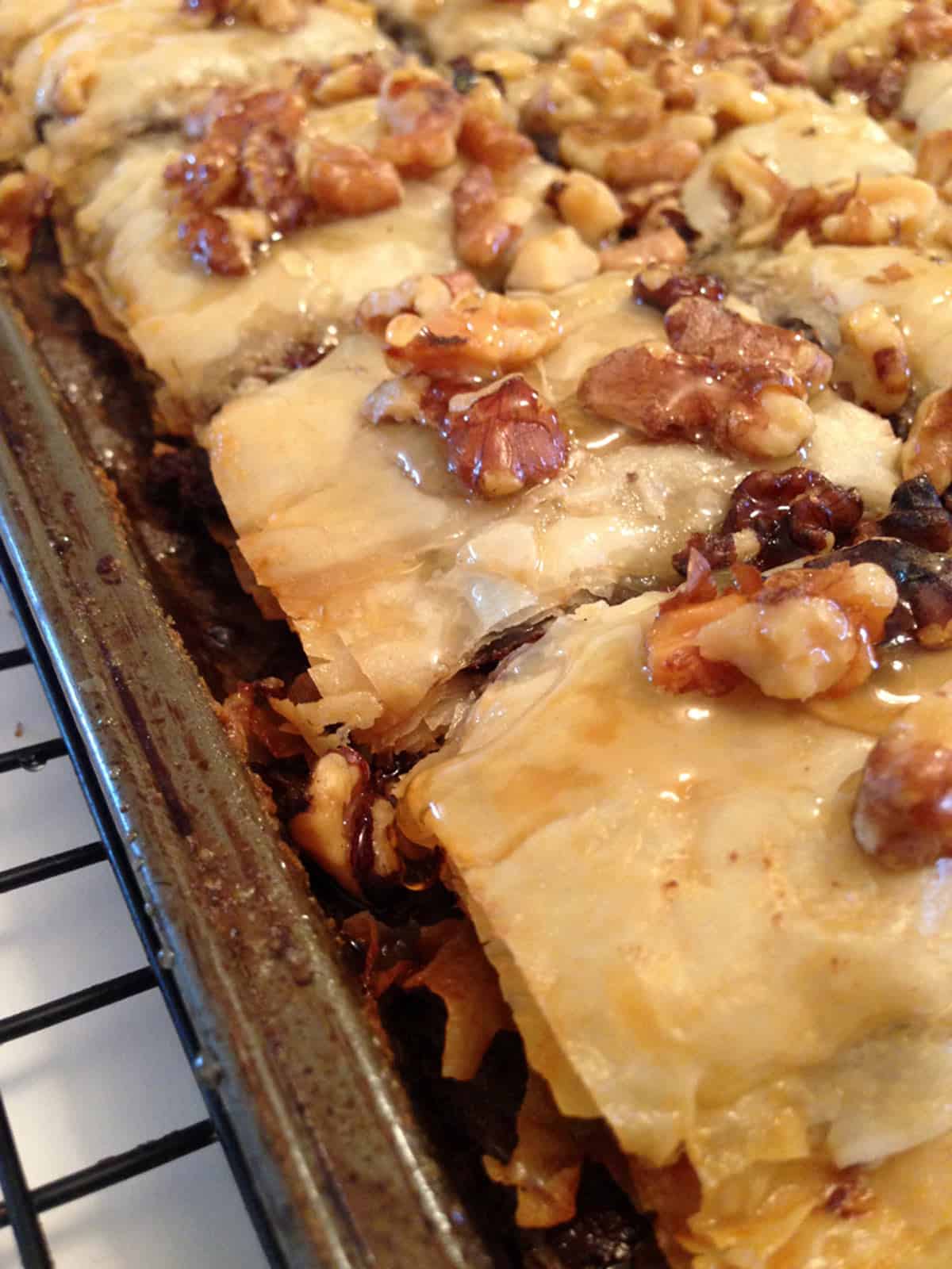 A pan of dessert covered with chopped nuts.