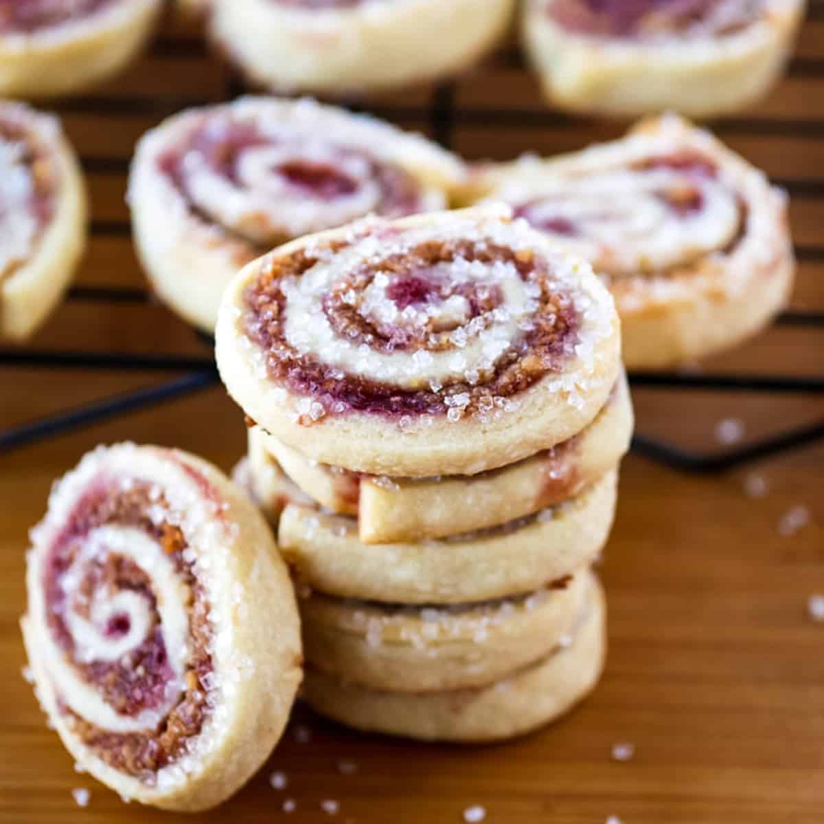 A stack of pinwheel cookies sprinkled with large crystals of sugar.