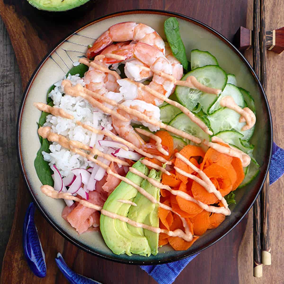 A bowl of shrimp and cucumbers.