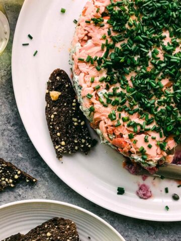 A plate of food with some dark bread.