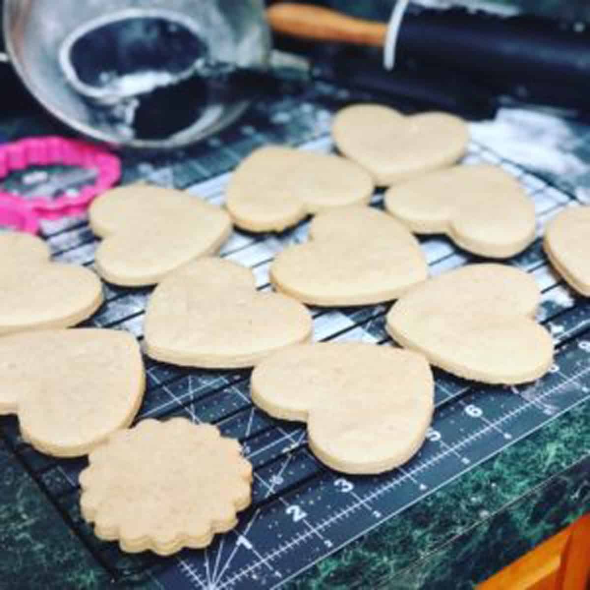 A bunch of cookie cut out like hearts.