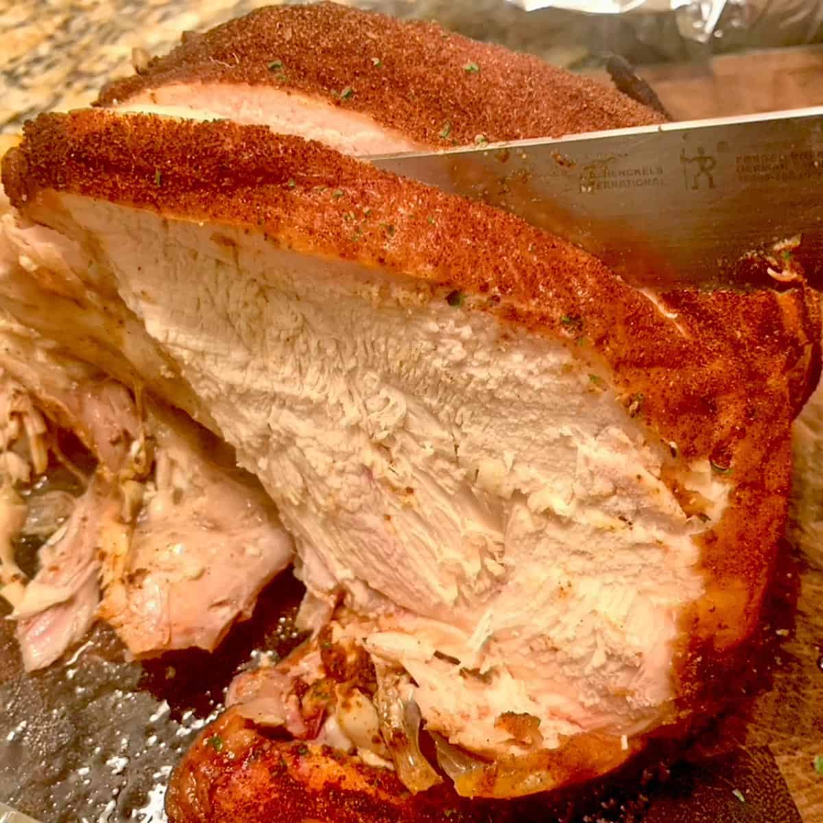 Slicing into some smoked chicken breast.