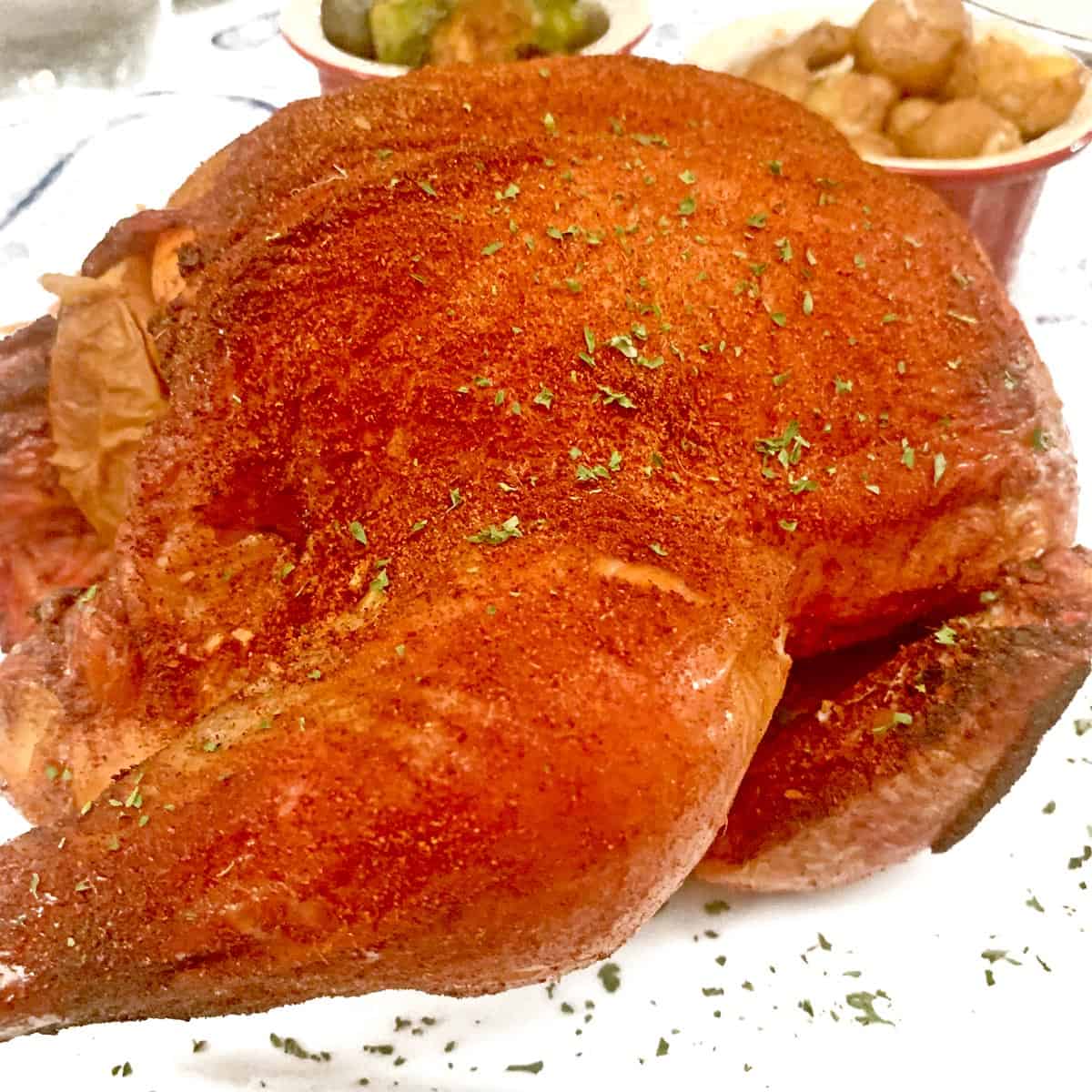 A smoked whole chicken ready to eat.