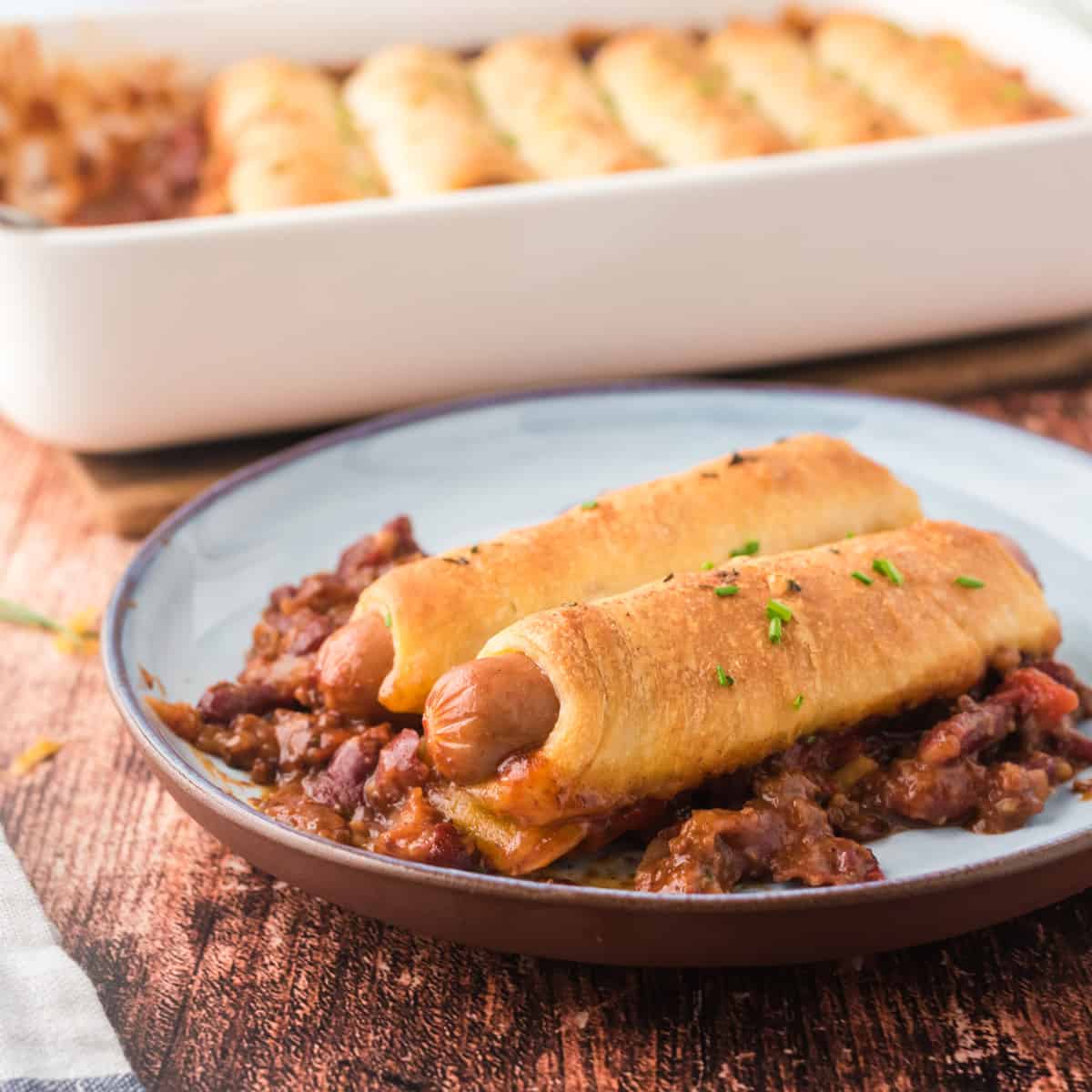 A serving of chili cheese dog casserole on a plate.