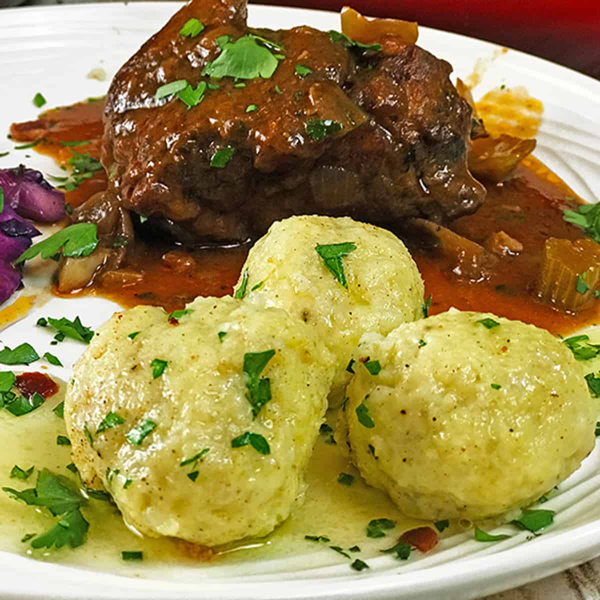 A plate of meat and potato dumplings.