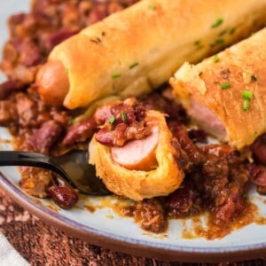 A bite of a chili cheese dog casserole.