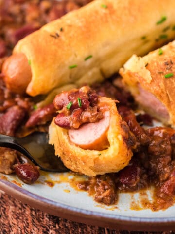 A bite of a chili cheese dog casserole.