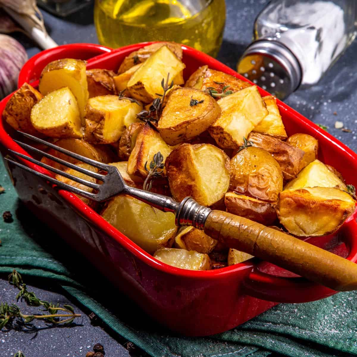 A red pan of roasted potatoes.
