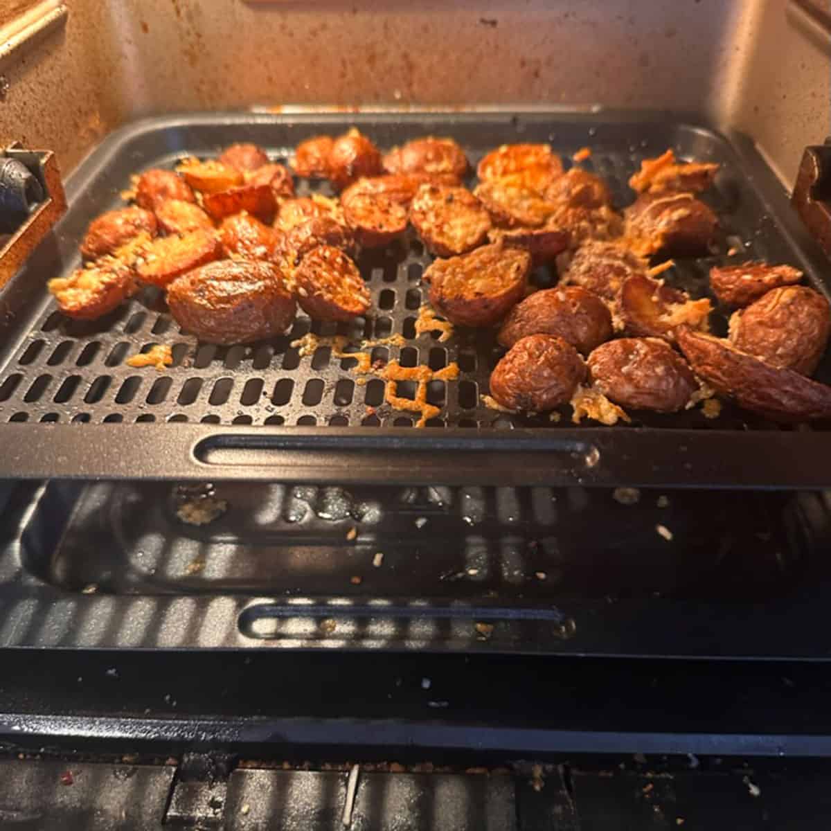 Some crispy potatoes on a rack.