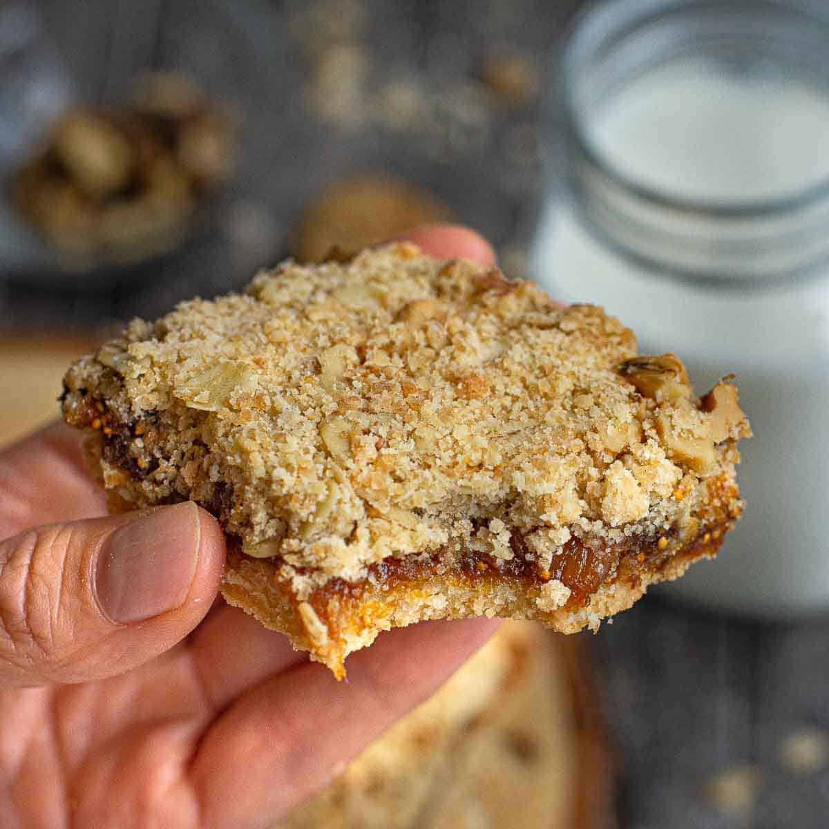 A fig bar with a bite taken out of it.