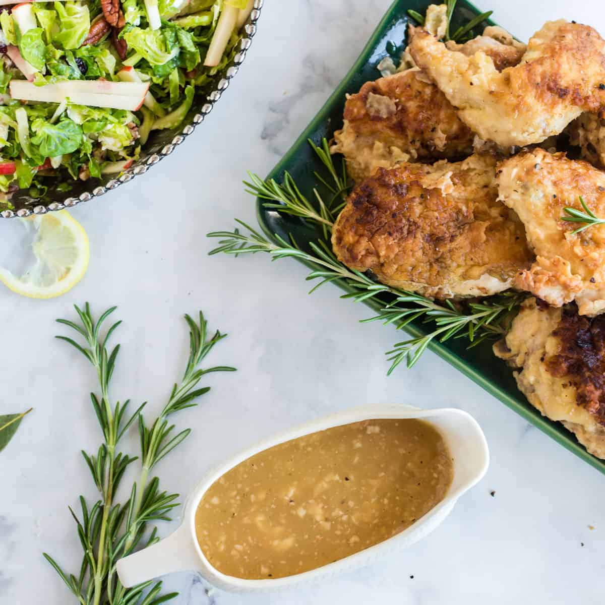 Chicken, gravy, and salad.