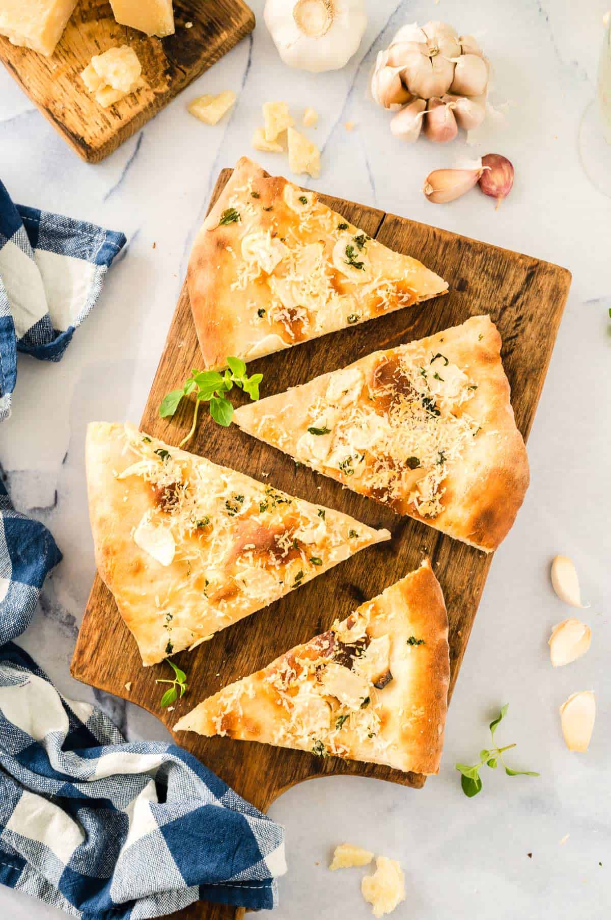 Slices of pizza on a cutting board.