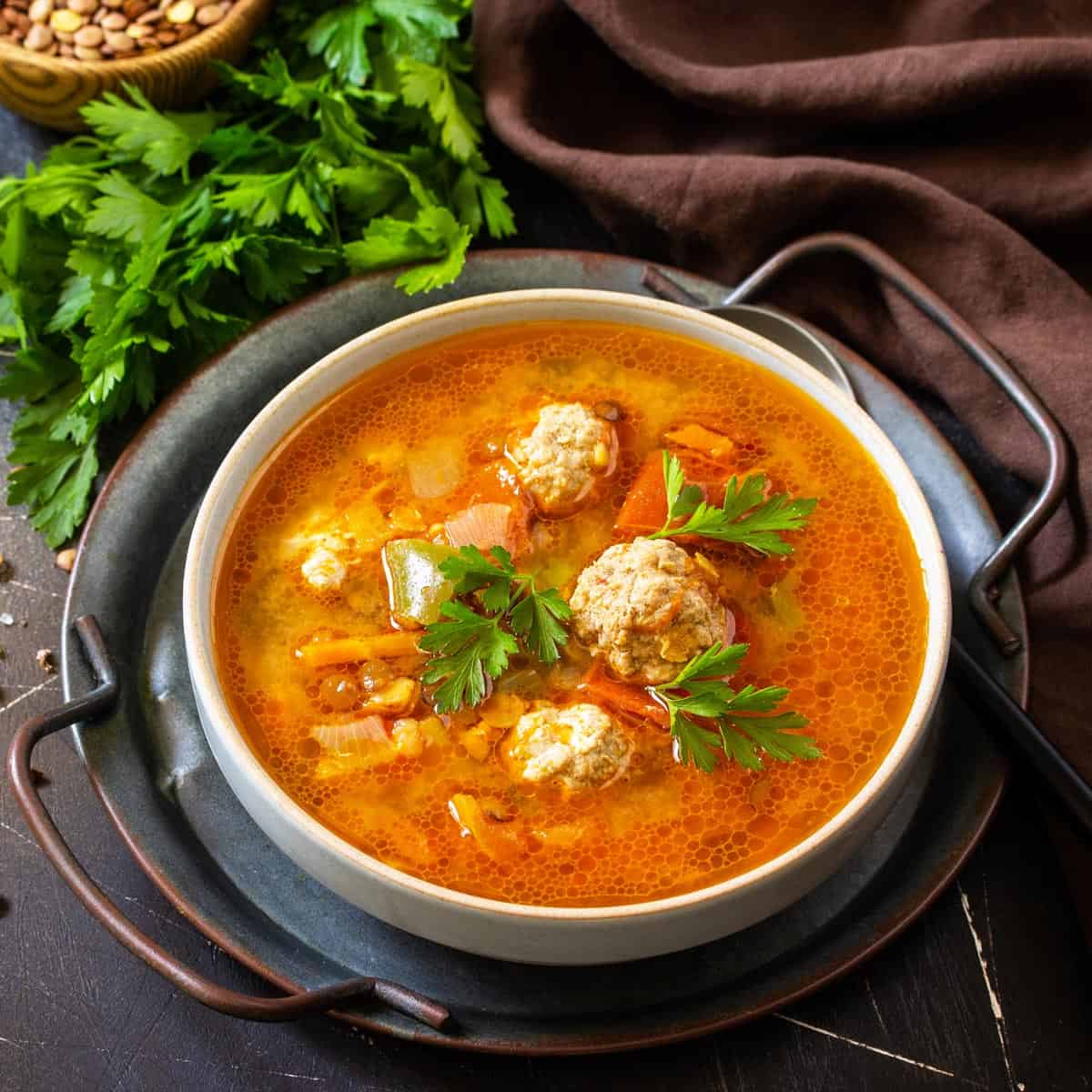 A bowl o meatball soup.