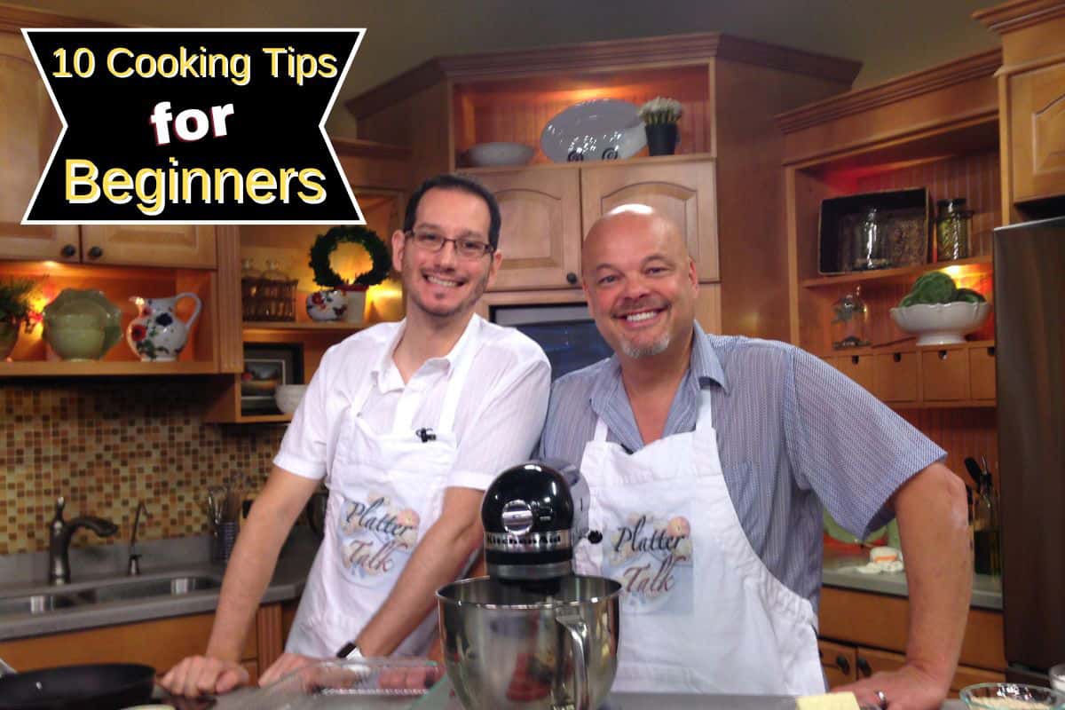 Two guys standing in a kitchen.