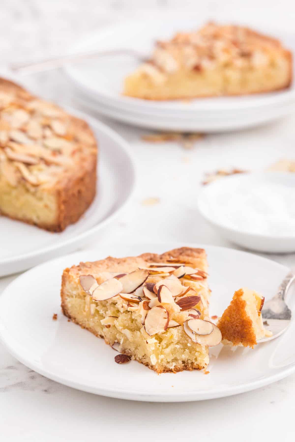 A slice of Swedish almond cake on a plate.