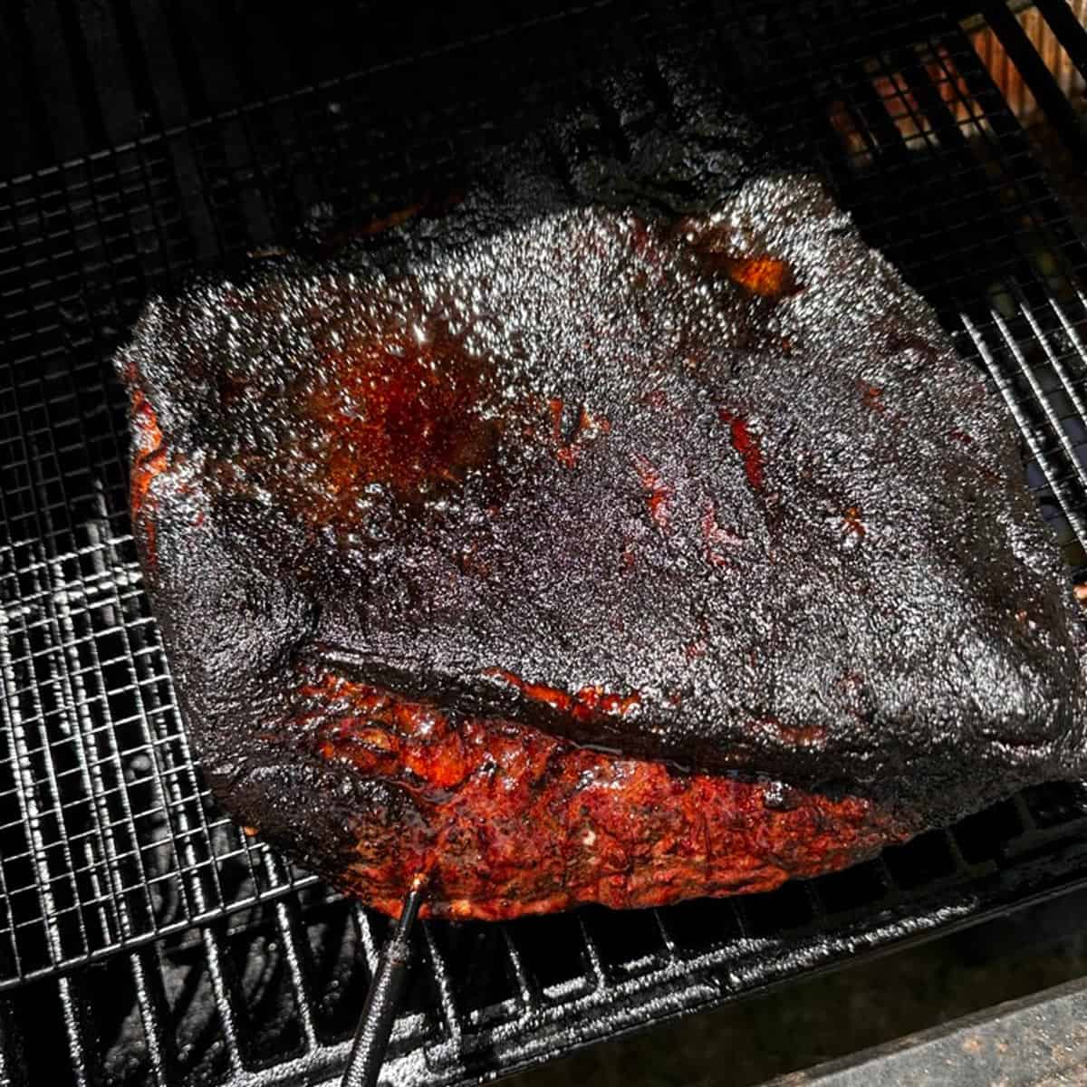 A brisket on a grill