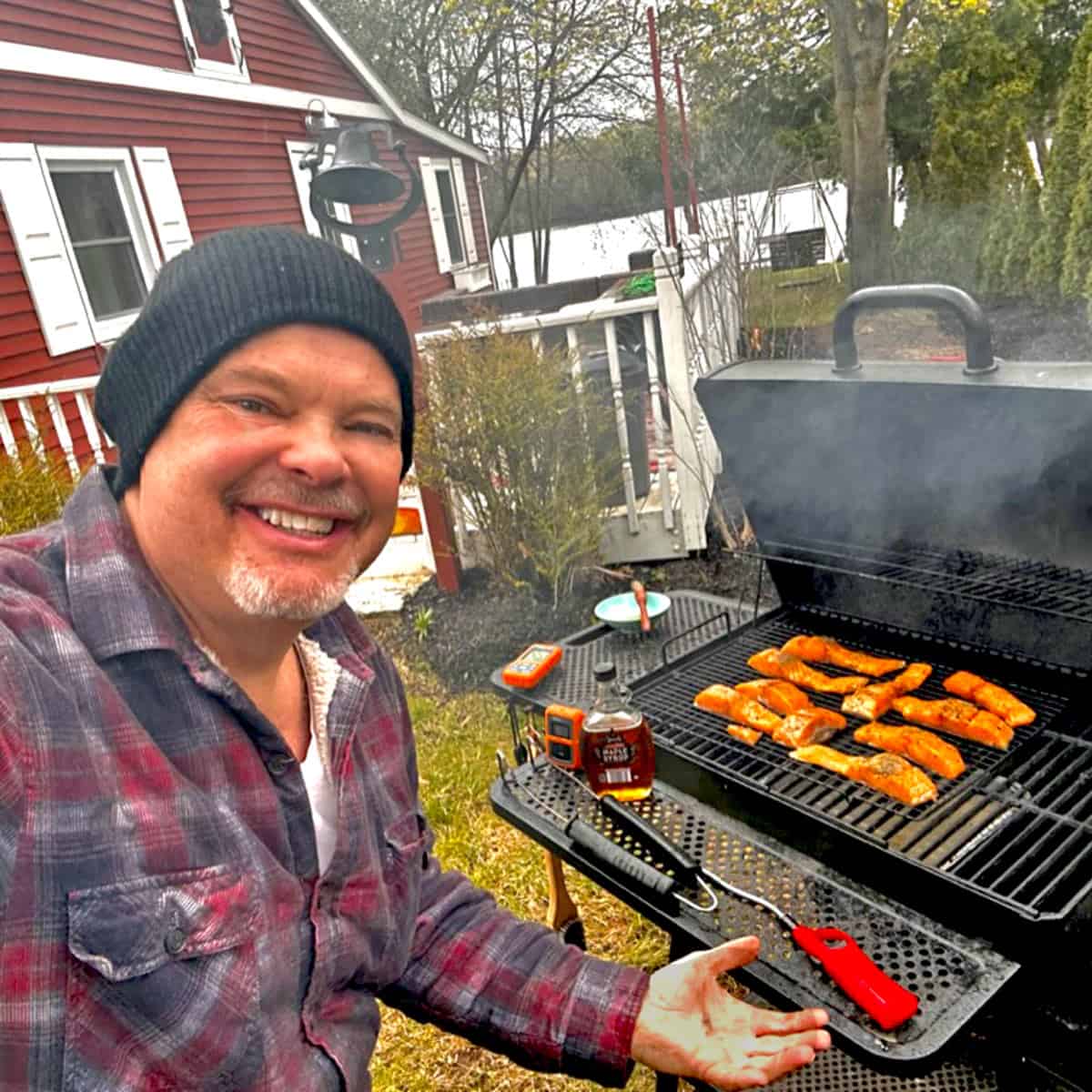 A man, making smoked salmon.