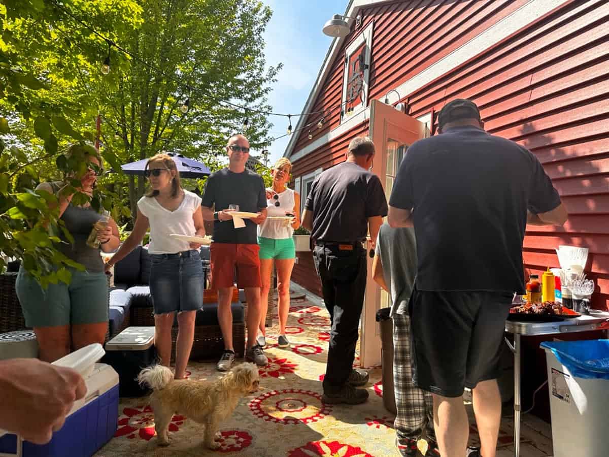 A bunch of people at a cookout.