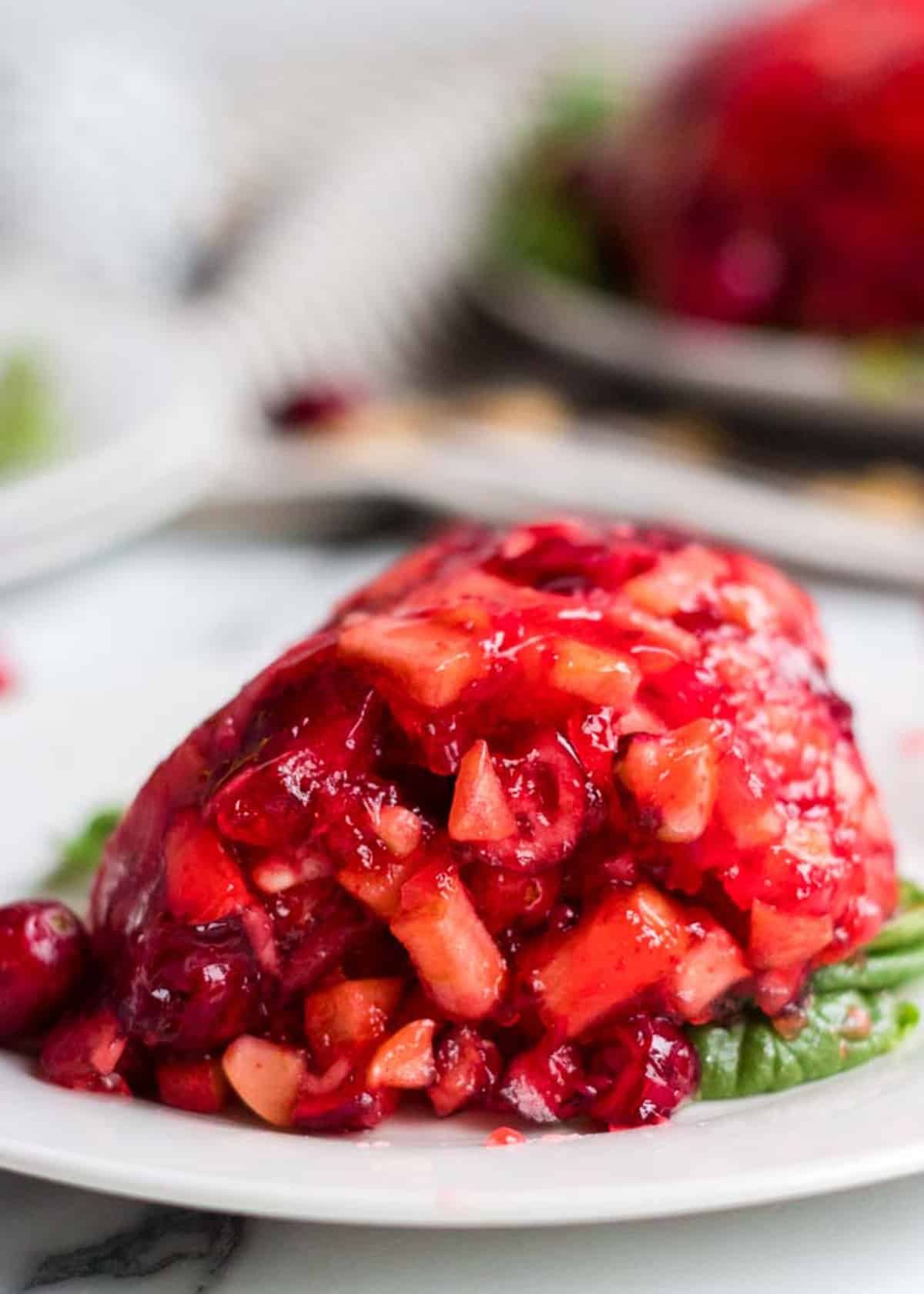 Portion of cranberry salad on a plate.