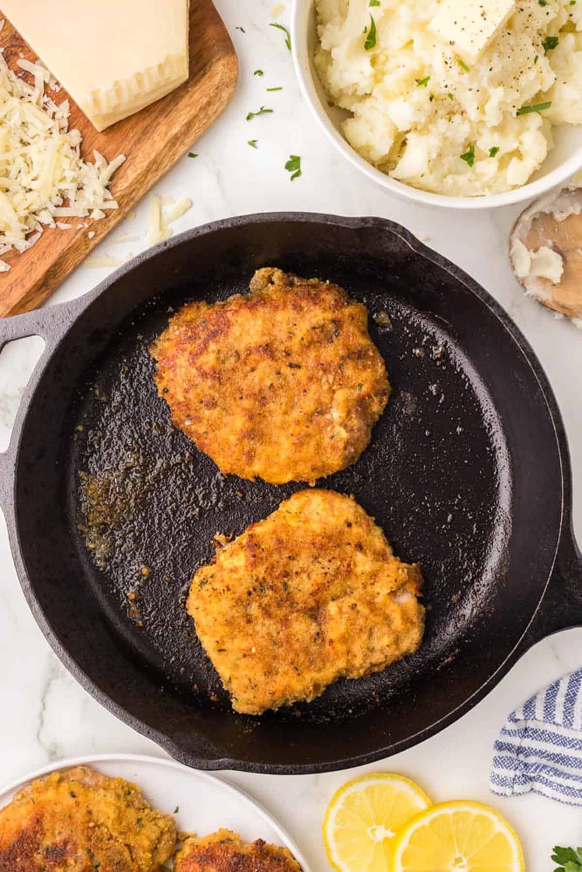 2 pork chops in a pan.