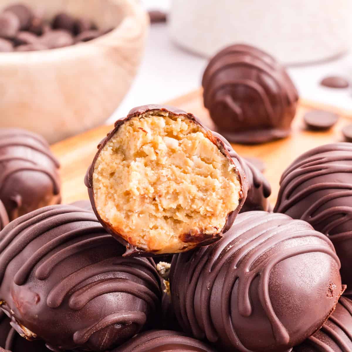 A pile of chocolate and peanut butter truffles.