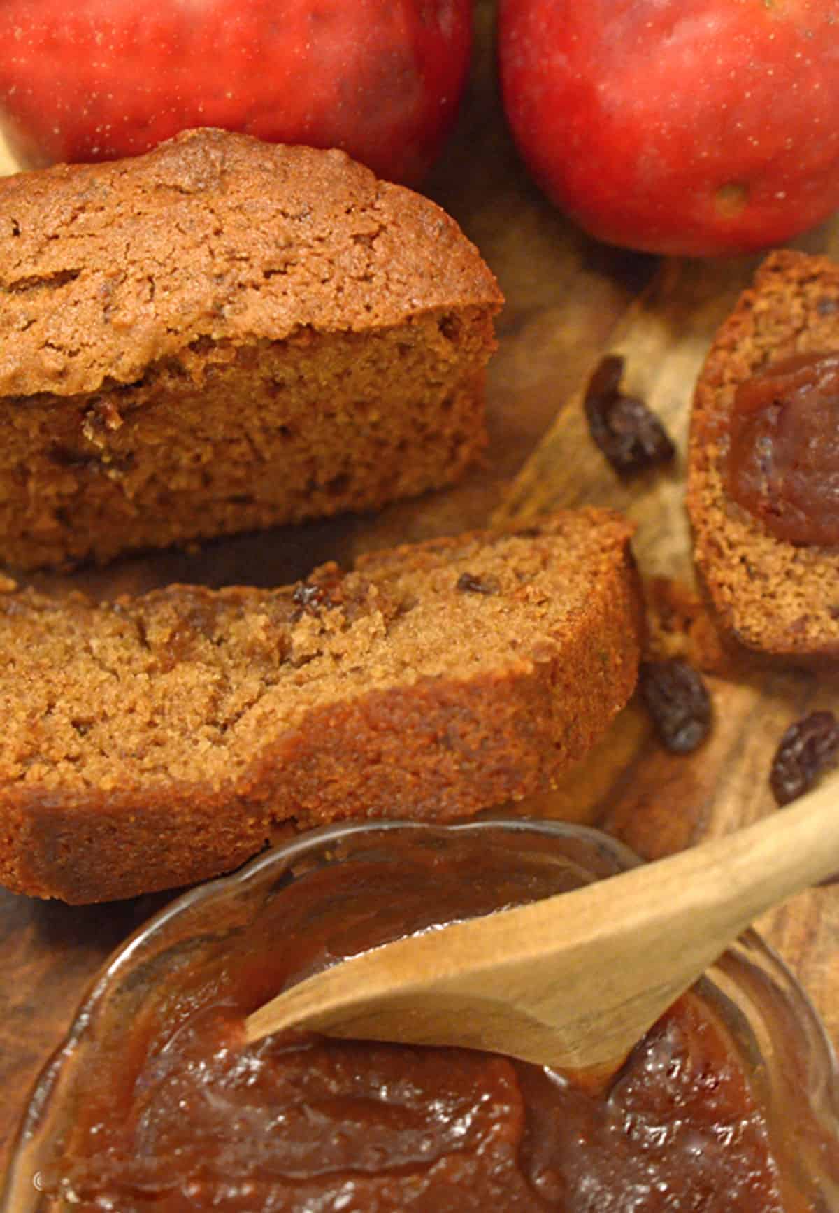 Some apple butter bread sliced up on a cutting board.