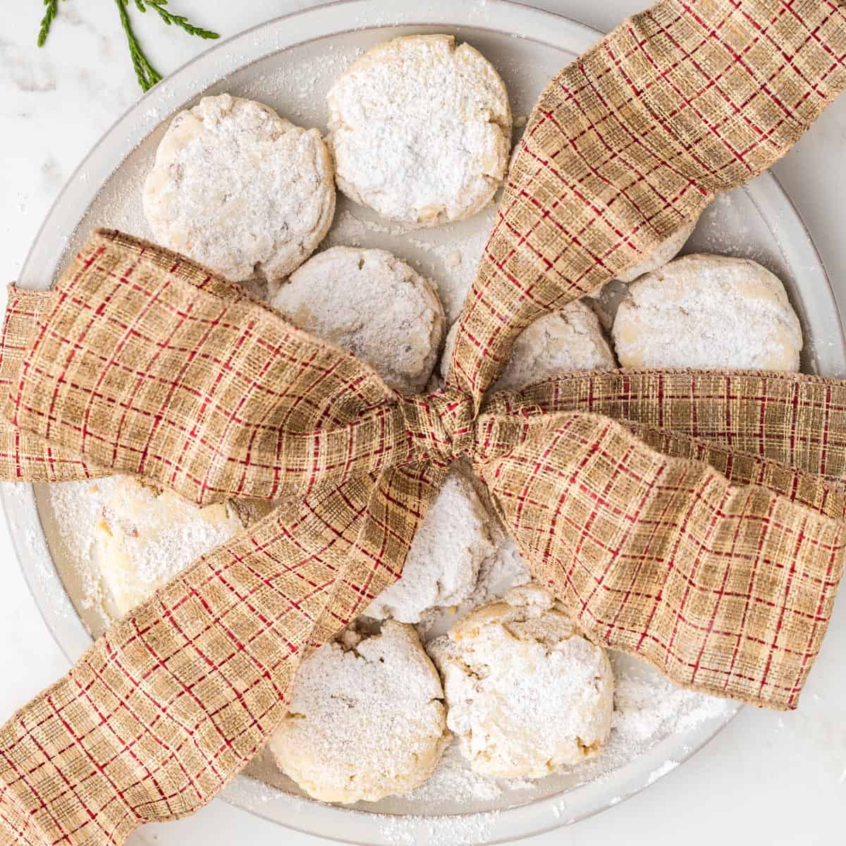 A tray of cookies with a ribbon.