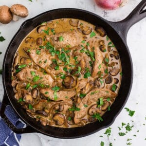 An overhead view of a skillet of veal Marsala.