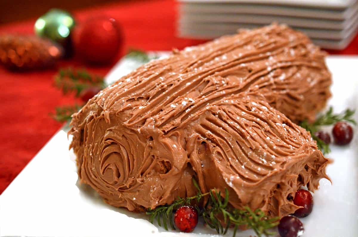 A chocolate ganache Yule log on a plate.