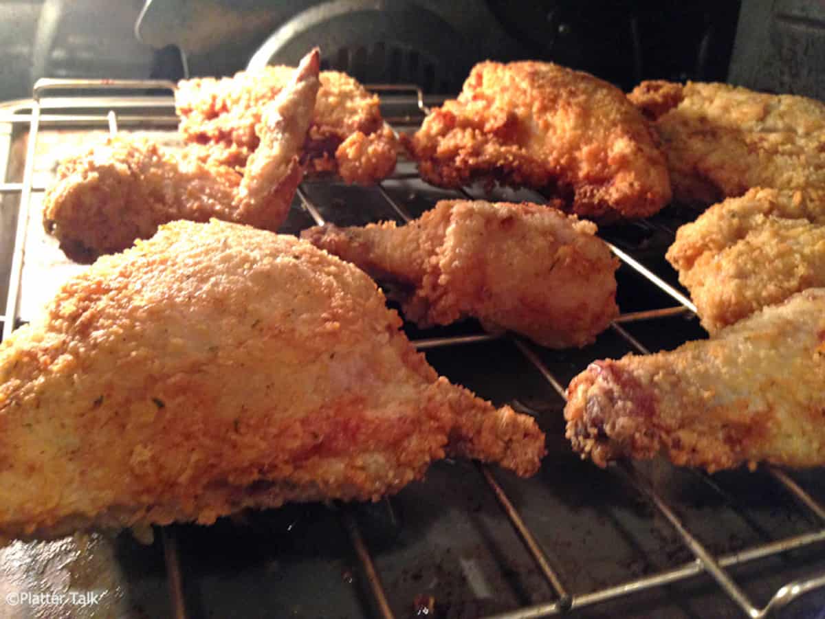 Some pieces of fried chicken in the oven.