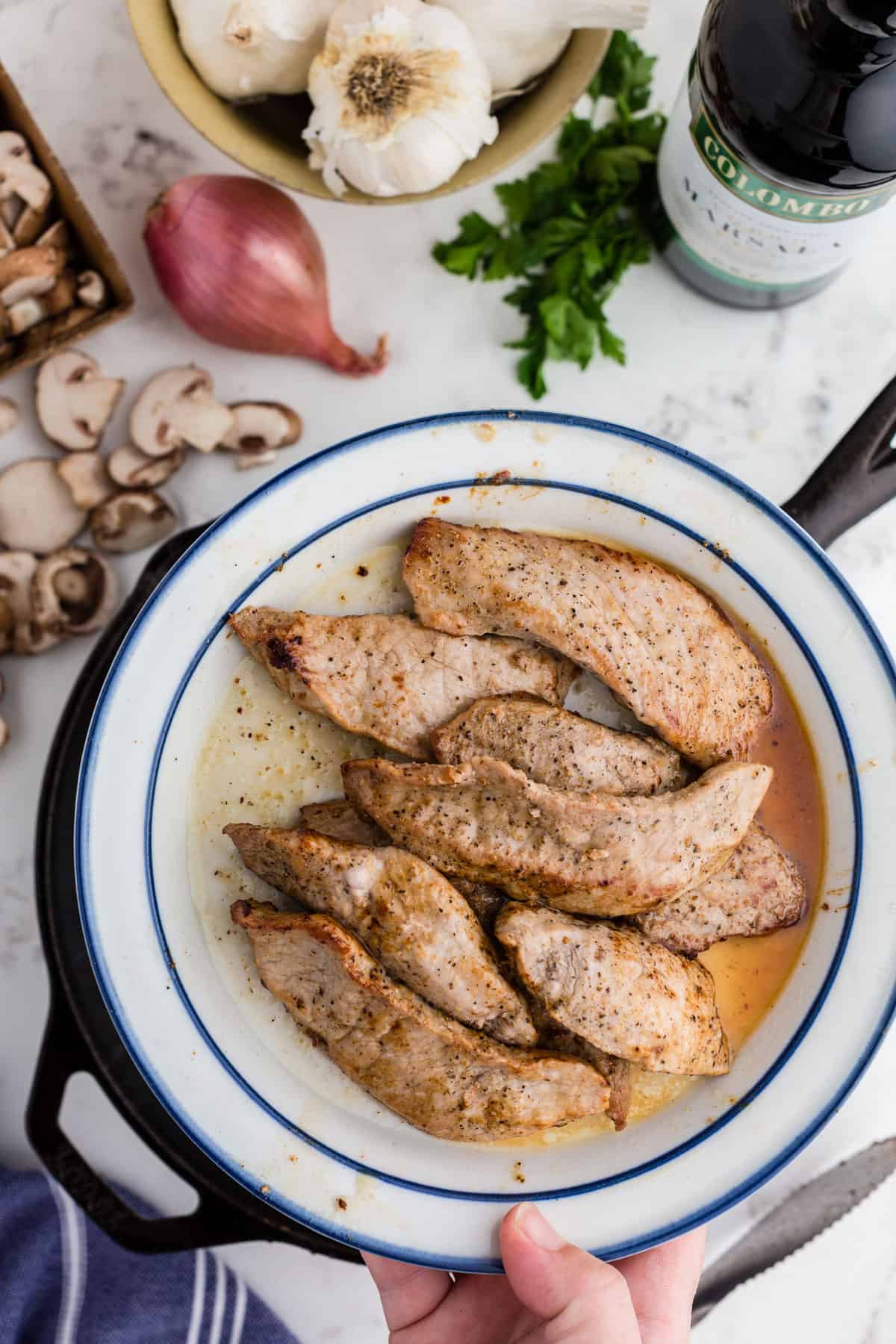 A plate of browned veal cutlets.