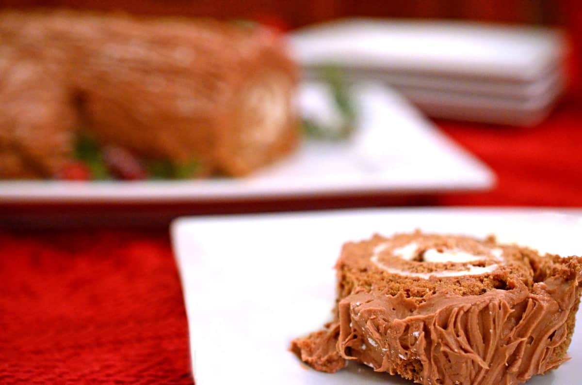 A slice of a Yule log on a plate.