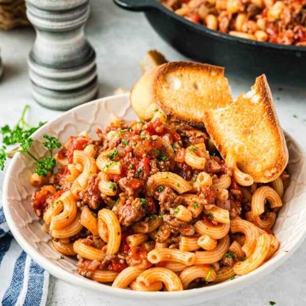 A dish of old fashioned goulash with some crusty bread.