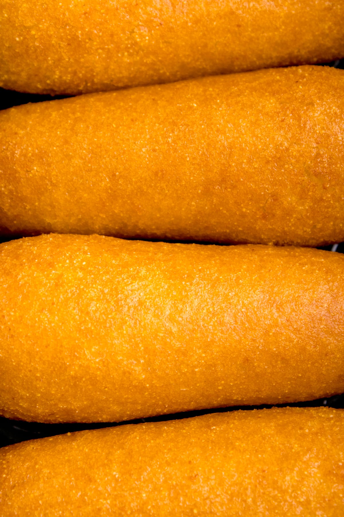 Close up of frozen corn dogs made in the air fryer.