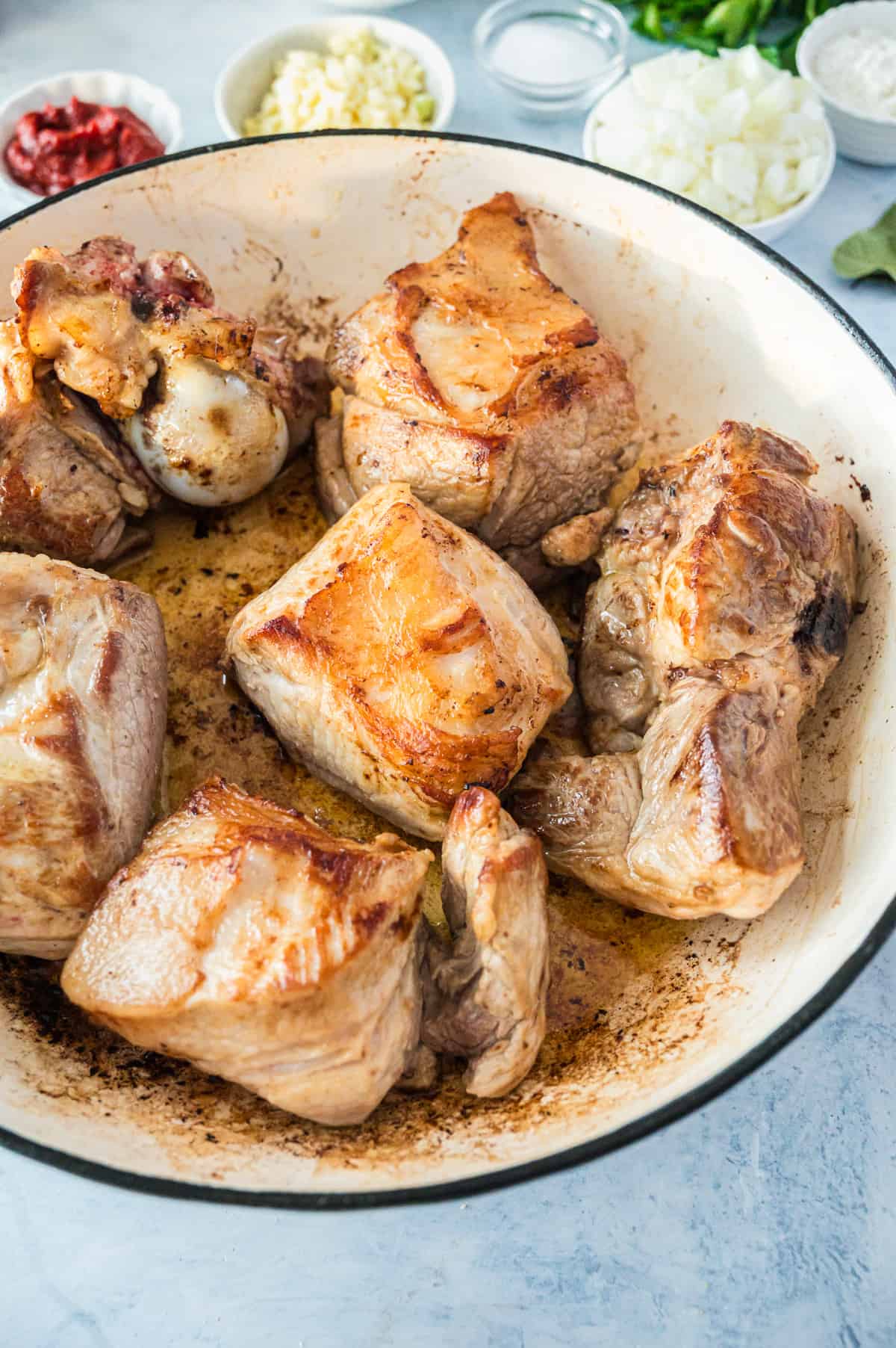 Some browned meat in a pot.