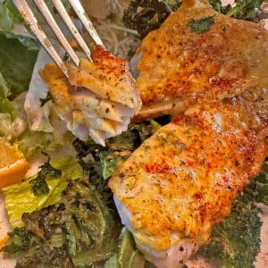 A fork grabbing a bite of golden fish.