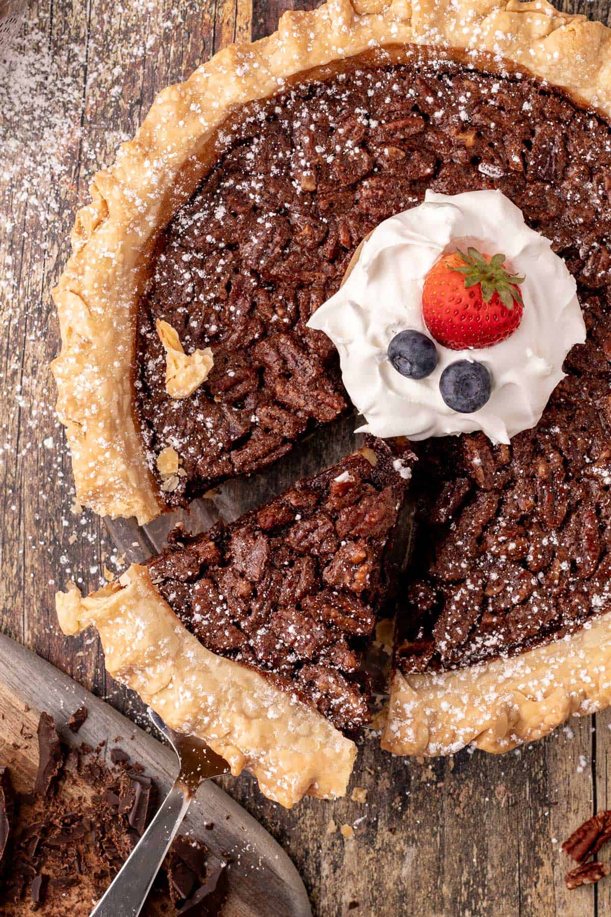 Serving a slice of chocolate chess pie.