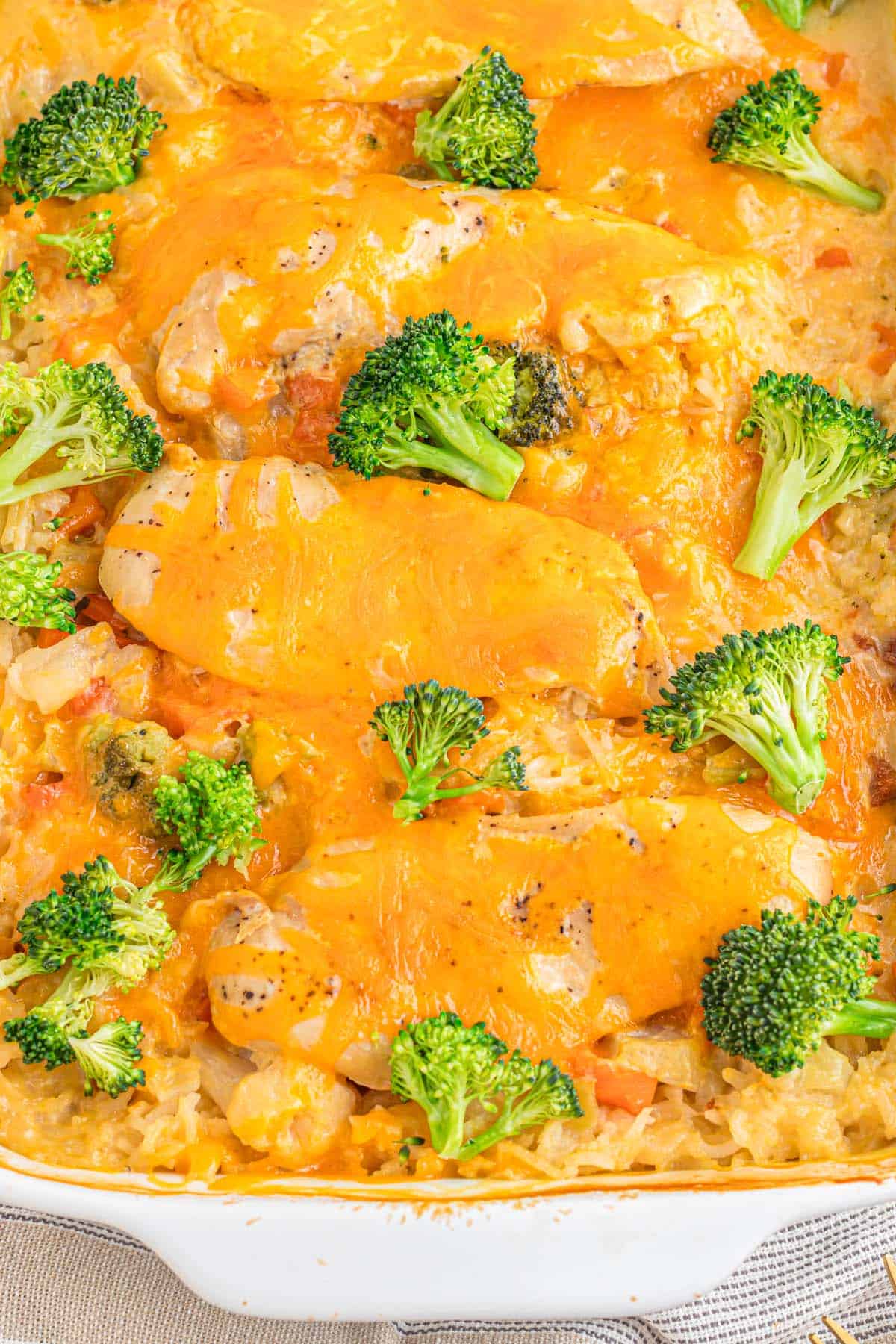 A cheesy casserole dish with broccoli.