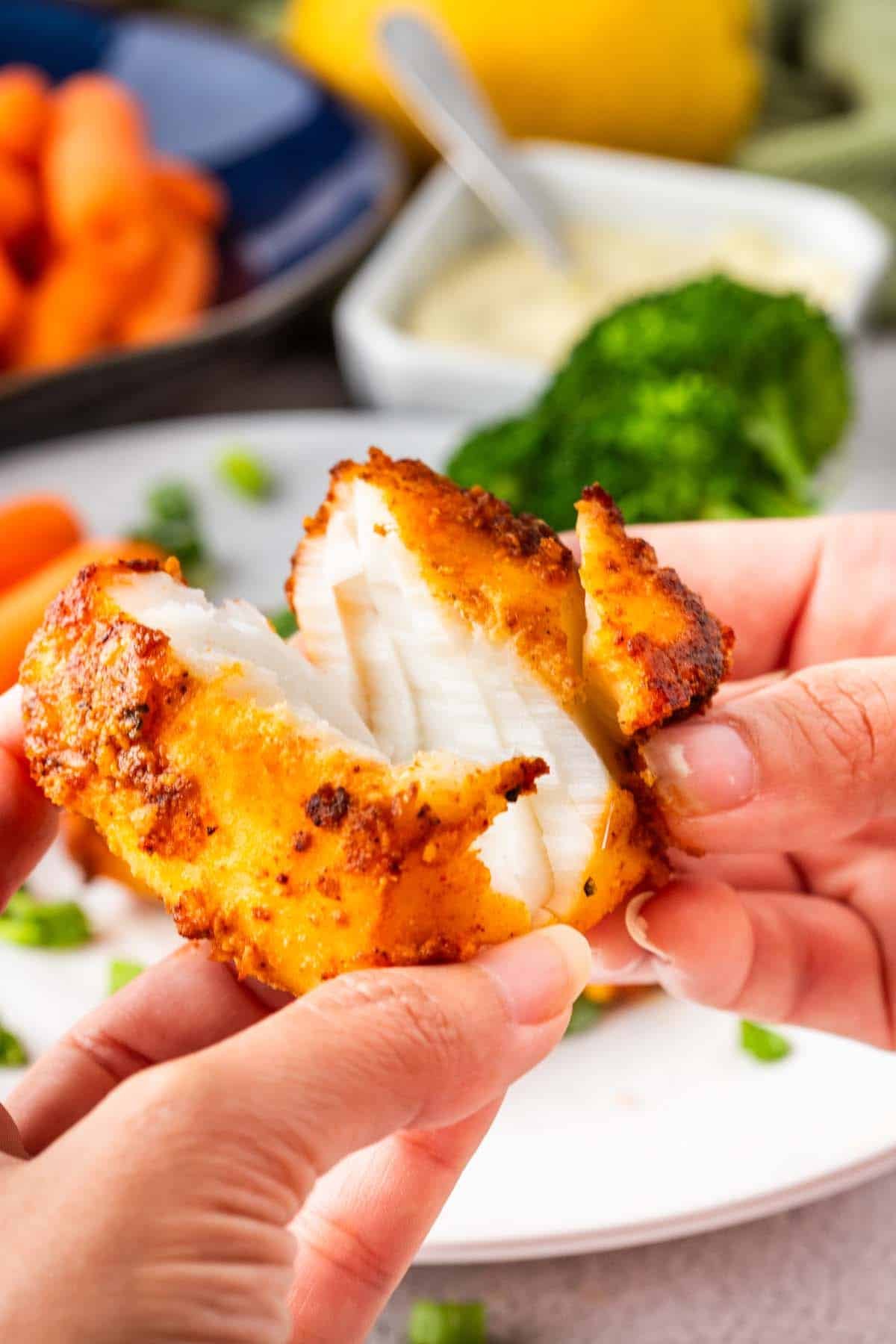 A piece of golden fish, split open and flakey.
