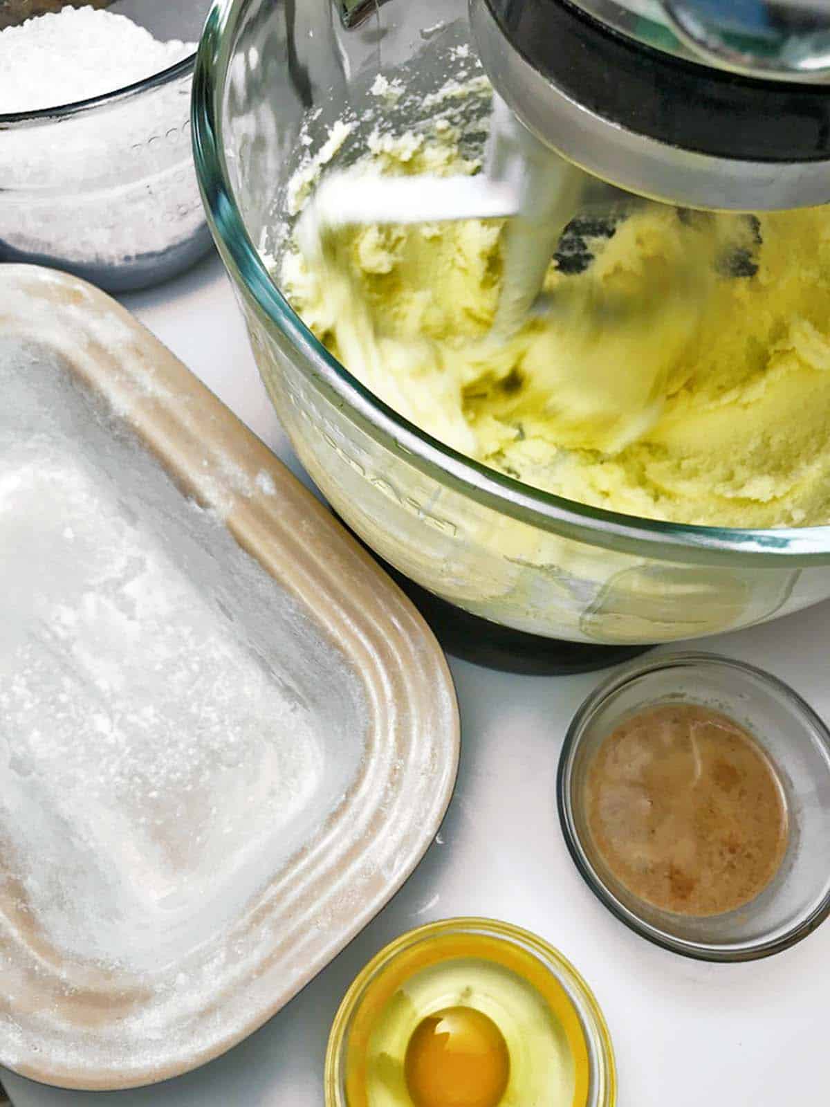 Mixing some cake batter in a stand mixer.