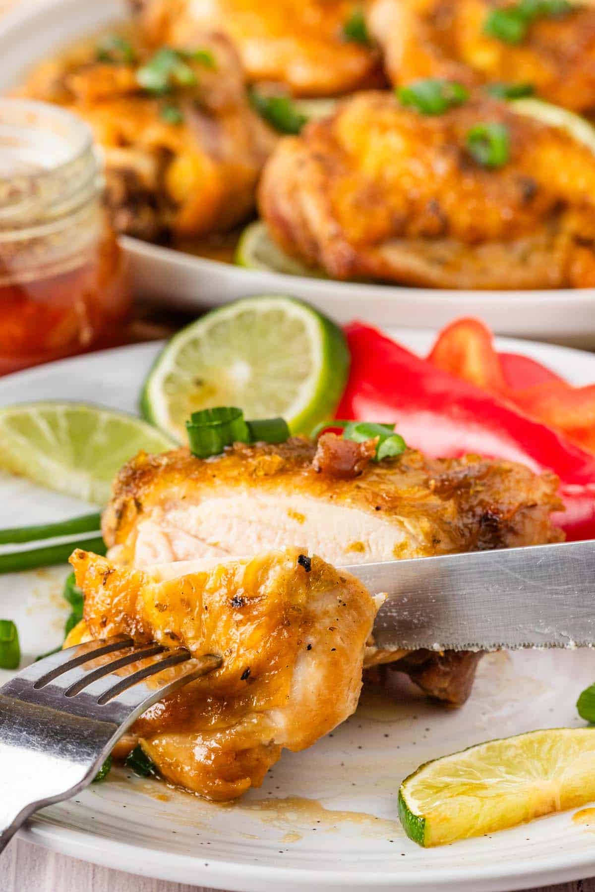 Cutting into a piece of golden brown chicken.