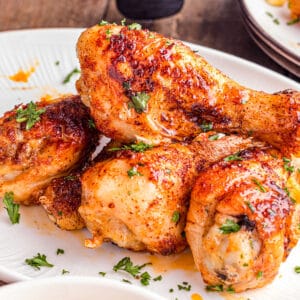 A plate of air fryer chicken drumsticks.