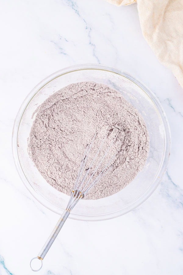 A mixing bowl with a whisked combination of cocoa and flour.