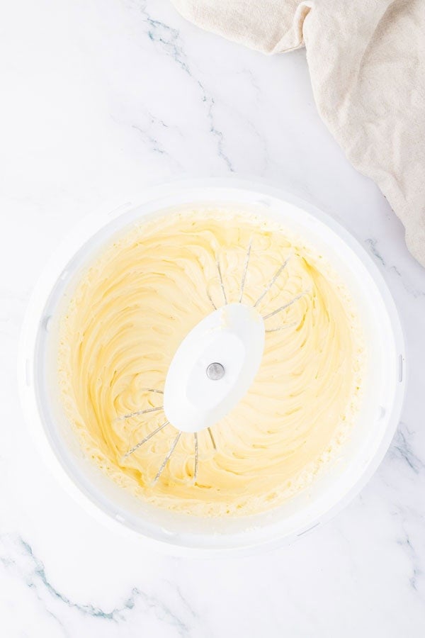 A mixing bowl with a creamy mixture.